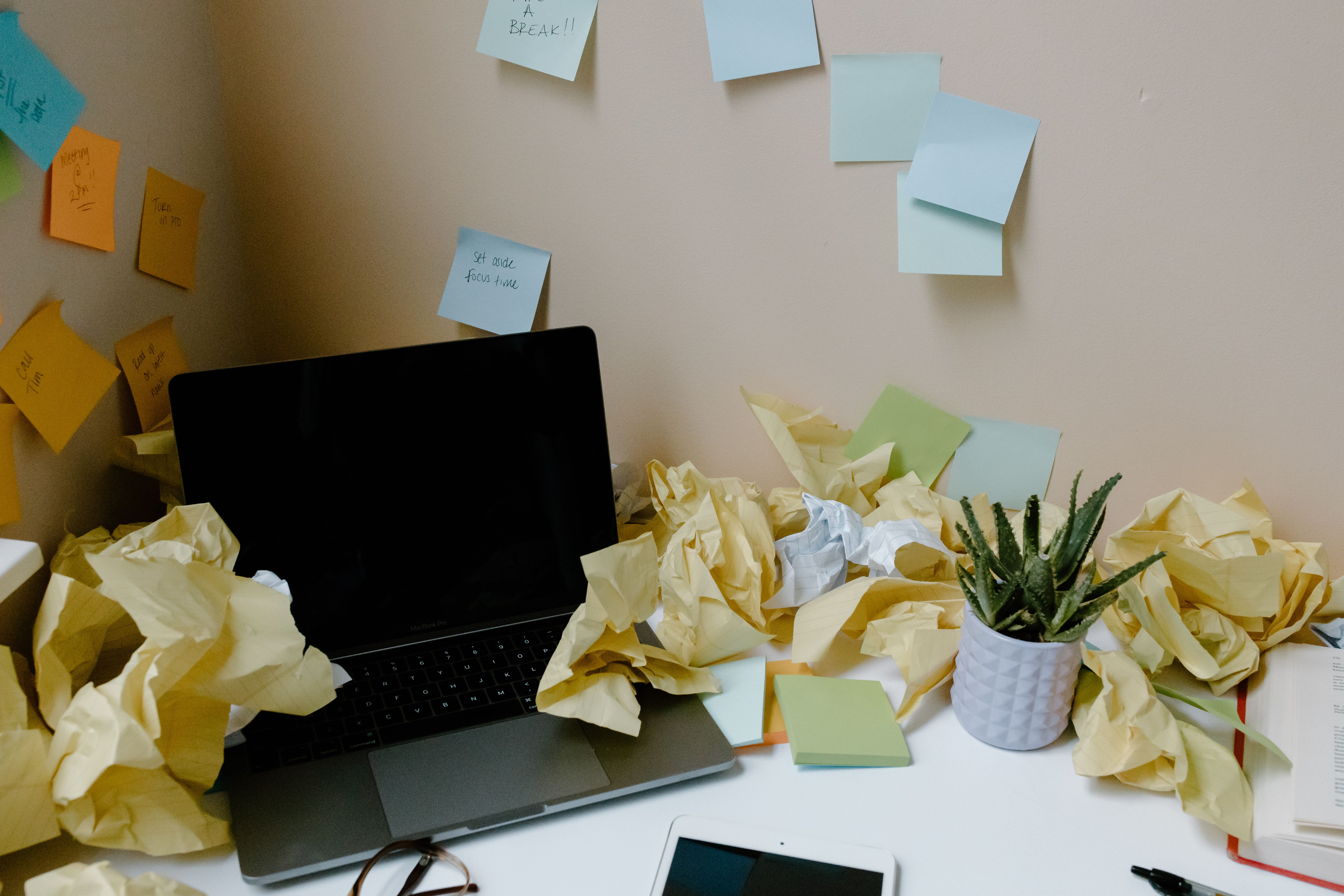 Chaotic messy office desk representing a cluttered WordPress plugin dashboard