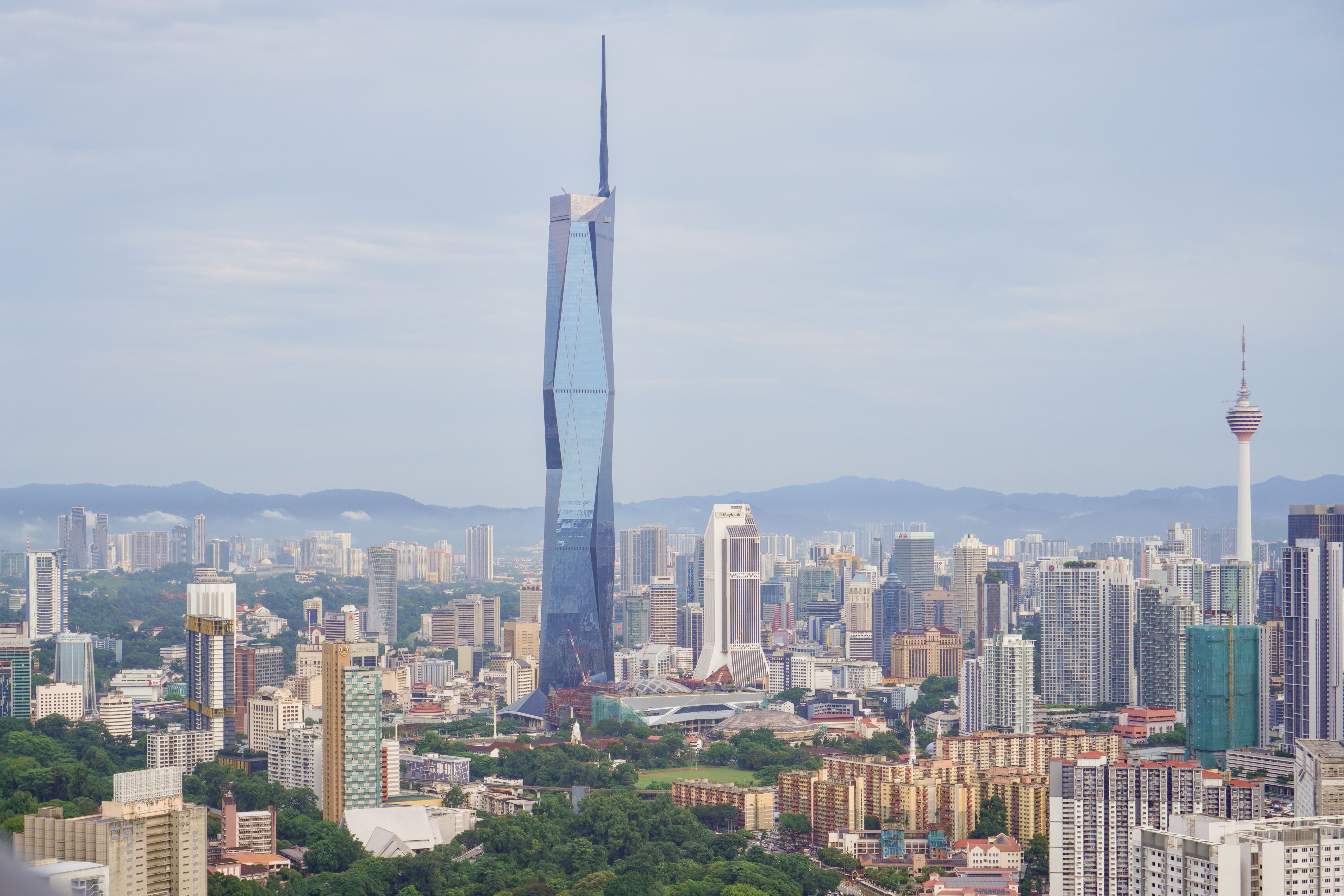 Aerial view of the Kuala Lumpur skyline featuring Merdeka 118 and KL Tower, symbolising modern Malaysia