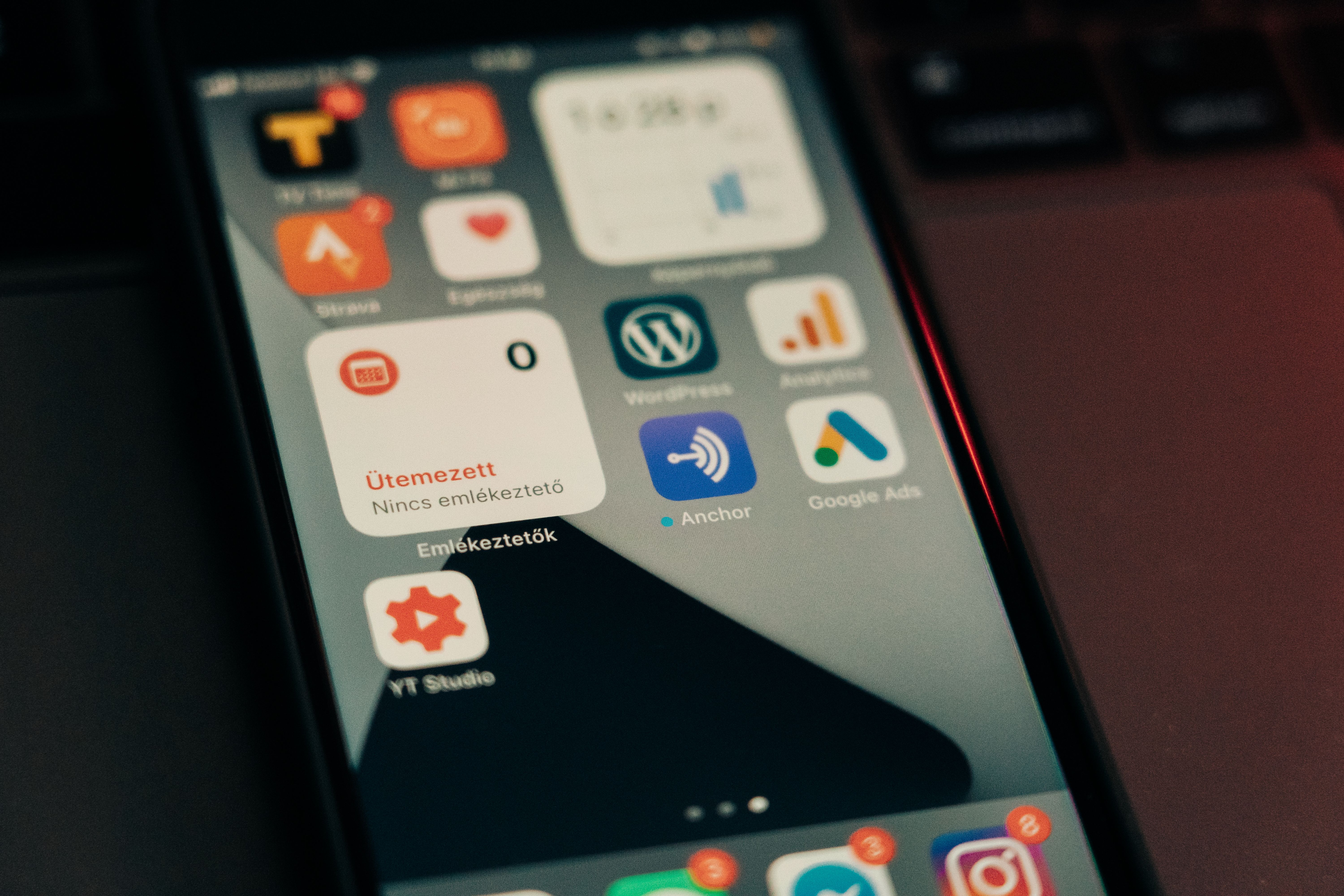 Smartphone screen crowded with app icons and notifications illustrating too many WordPress plugins