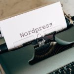Vintage typewriter with paper labeled WordPress, representing a WordPress blog platform