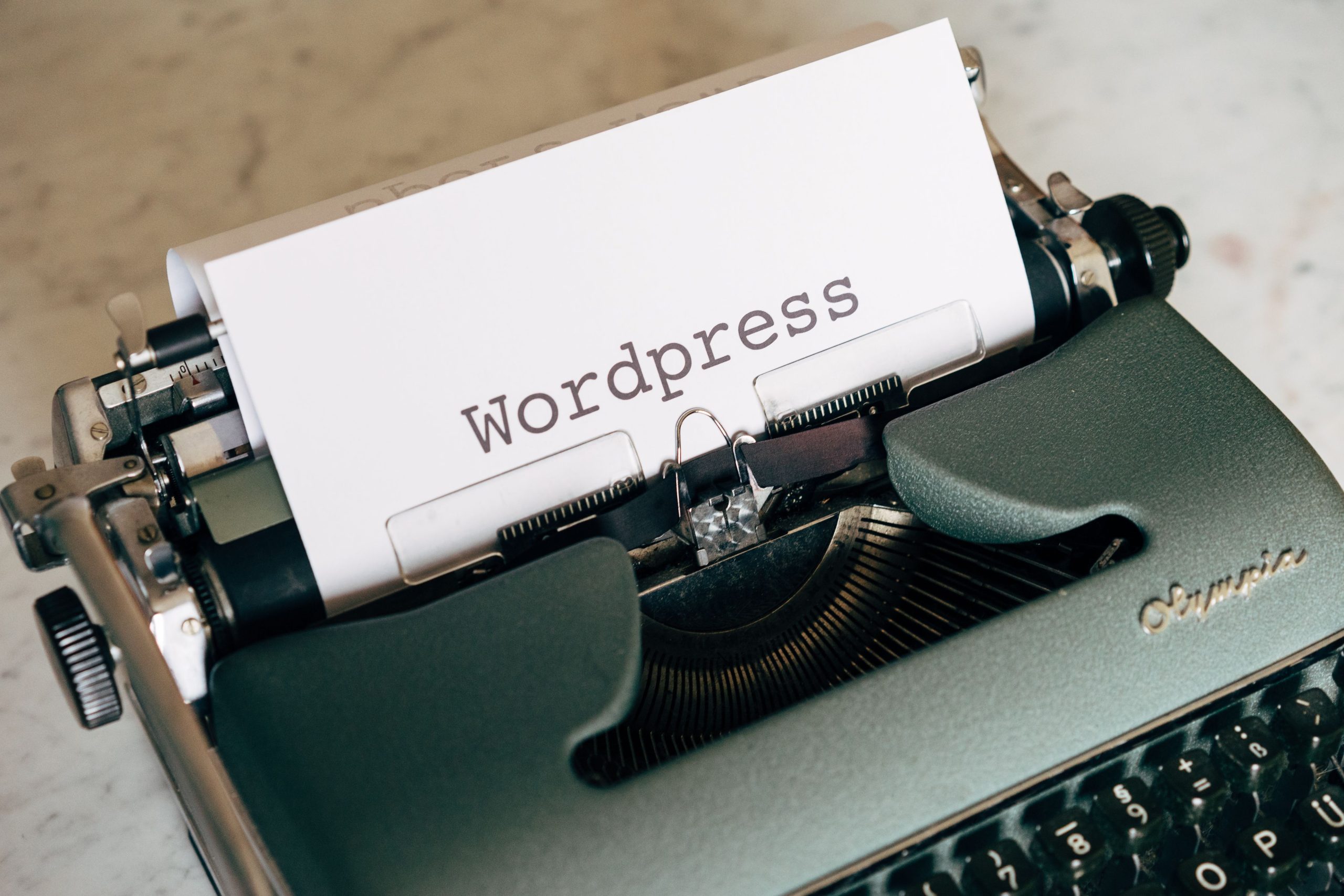 Vintage typewriter with paper labeled WordPress, representing a WordPress blog platform